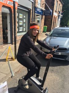 A member of the Homesure Property team on an exercise bike, completing the charity cycling challenge.